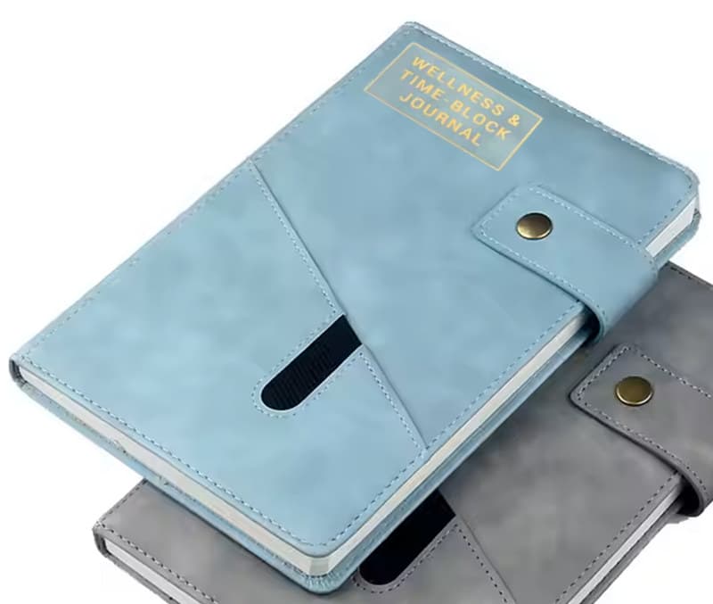 The Wellness & Time-Block Journal, light-blue cover with gold lettering
